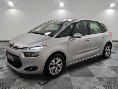 the silver citrole is parked on a checkered tile floor