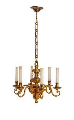 an image of a chandelier with five candles hanging from it