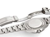 a close up of a watch on a bracelet on a white surface