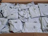 a cardboard box full of white shirts in a room