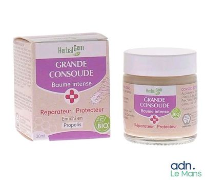 une image représentant un pot de crème à côté d'une boîte de crème