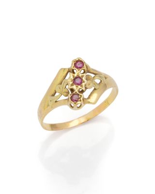 a gold ring with a pink stone center