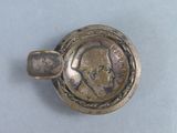 a silver coin with a picture of a man on it
