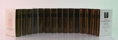 several books are lined up in a row on a white surface