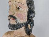 a statue of a man with a beard and a beard