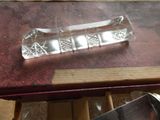 a knife sitting on top of a book on a table
