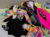 a pile of clothing that is on a white table