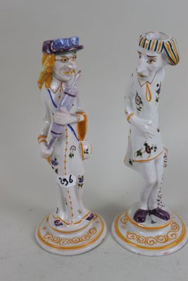 pair of porcelain figurines of a man and a woman
