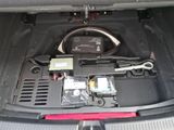 the interior of a car with a steering control panel and a dash board