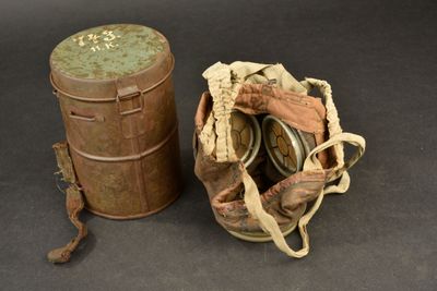 an old tin can and a bag on a table