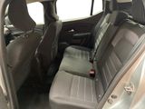 the back seats of a car with a remote control in it