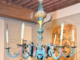 a chandelier that is hanging from the ceiling in a room