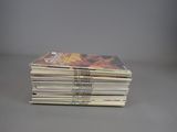 a lot of comics stacked on top of each other