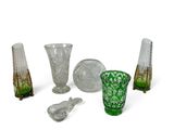a lot of glass items that are sitting on a table