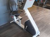 an image of a gym room with a stationary exercise bike