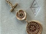 an image of a gold plated watch with a compass on it