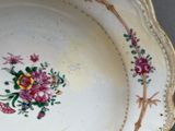a plate with a floral design on it on a table