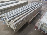 a pile of steel bars stacked on top of each other