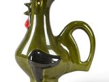 a green vase with a black rooster on it