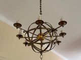 a chandelier hanging from the ceiling in a living room