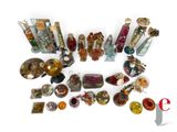 a lot of glass bottles with different designs on them