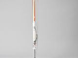 a close up of a lamp on a table with a cord
