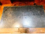 a blackboard on the top of a wooden box