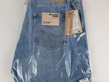 a close up of a pair of blue jeans wrapped in plastic