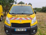 a yellow van that is parked in the grass