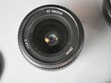 a camera lens sitting on top of a table next to a camera lens