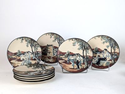 six plates with a picture of a man on a horse and a woman on a horse