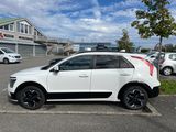 a white car that is parked in a parking lot