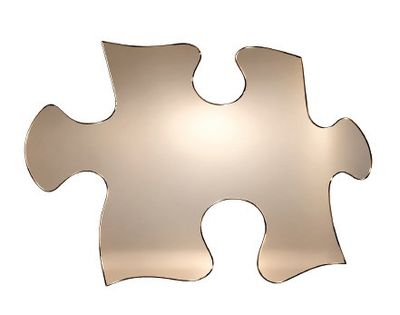 une pièce de puzzle en métal à laquelle il manque un morceau