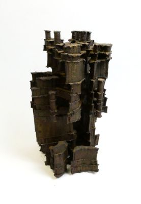 a sculpture of a castle made out of metal pipes