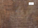 a piece of wood that has a label on it