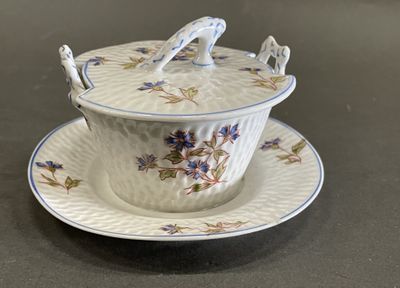 a bowl and saucer on a plate on a table