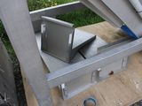 a small metal box sitting on top of a wooden table