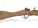 an old wooden rifle with a wooden barrel and a wooden handle
