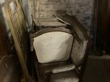 a chair that is sitting in the corner of a room
