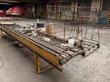 a long table that has a lot of metal rods on it