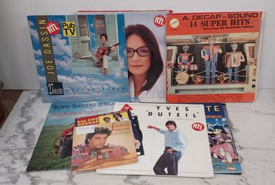 a lot of books and dvds on the table