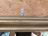a close up of a mirror with a wooden frame