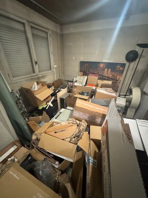 a room with a lot of boxes and boxes on the floor