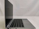 an open laptop computer sitting on top of a white table