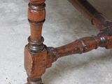 a wooden table with a wooden top and a wooden base