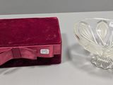 a small glass bowl and a small glass bowl on a table