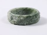 green jade ring on white background with white background