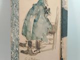 an old book with a drawing of a woman sitting on a chair