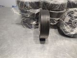 many rolls of wire wrapped in plastic on a table