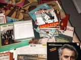 a pile of books on the floor of a room